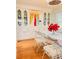Bright dining room with a glass table, with built in cabinets at 1829 Cypress Point Ln, Sarasota, FL 34234