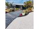 Charming home exterior with well-manicured landscaping and a colorful driveway at 1829 Cypress Point Ln, Sarasota, FL 34234