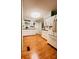 Bright kitchen with white cabinets, a white refrigerator, and hardwood floors at 1829 Cypress Point Ln, Sarasota, FL 34234