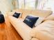 Bright living room with hardwood floors and a comfortable white leather sofa at 1829 Cypress Point Ln, Sarasota, FL 34234