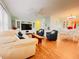 Spacious living area with hardwood floors that opens to the dining room at 1829 Cypress Point Ln, Sarasota, FL 34234