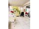 Relaxing sunroom with tile floors, windows, and comfortable seating at 1829 Cypress Point Ln, Sarasota, FL 34234