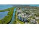 Scenic aerial view of waterfront condos with lush surroundings and beautiful water views at 1932 Harbourside Dr # 217, Longboat Key, FL 34228