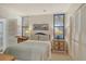Cozy bedroom with light gray walls, closet and natural light at 1932 Harbourside Dr # 217, Longboat Key, FL 34228