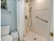 Updated walk-in shower with grab bars, rainfall shower head and porcelain tile surround at 1932 Harbourside Dr # 217, Longboat Key, FL 34228