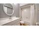 This bathroom features tile flooring, a vanity with a sink, and a shower-tub combo at 2385 Tall Oak Ct, Sarasota, FL 34232