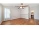 Spacious bedroom featuring hardwood floors, neutral paint, a window, and an ensuite bath at 2385 Tall Oak Ct, Sarasota, FL 34232