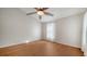 Bright bedroom with hardwood floors, a fan, and natural lighting from a bright window at 2385 Tall Oak Ct, Sarasota, FL 34232