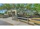 Inviting covered entryway to a building in the community, providing shelter and a welcoming atmosphere at 2385 Tall Oak Ct, Sarasota, FL 34232