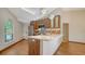 Bright kitchen featuring a large island, stainless steel appliances, and stylish pendant lighting at 2385 Tall Oak Ct, Sarasota, FL 34232