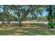 A lovely neighborhood landscape with green space, mature trees, and manicured lawn at 2385 Tall Oak Ct, Sarasota, FL 34232