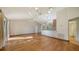 Bright living room with hardwood floors, vaulted ceiling, and generous natural light at 2385 Tall Oak Ct, Sarasota, FL 34232