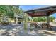 Gather at the covered picnic area, featuring tables and grills, perfect for outdoor meals and gatherings at 2385 Tall Oak Ct, Sarasota, FL 34232