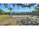 Enjoy a match on the community's fenced tennis court, surrounded by lush greenery and mature trees at 2385 Tall Oak Ct, Sarasota, FL 34232