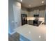 Modern kitchen featuring stainless steel appliances and light countertops at 24807 Buckingham Way, Port Charlotte, FL 33980