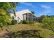 Well-manicured lawn and tropical landscaping surrounding this home at 3390 Yonge Ave # 41, Sarasota, FL 34235