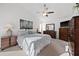 Primary bedroom suite with vaulted ceiling, plush carpet, and neutral decor with a sitting area and dresser at 3390 Yonge Ave # 41, Sarasota, FL 34235