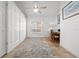 Home office features tiled floor, ceiling fan and built in cabinets at 3390 Yonge Ave # 41, Sarasota, FL 34235