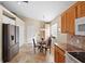 Bright kitchen includes stainless steel appliances, granite counters, a breakfast nook, and ample cabinet space at 3390 Yonge Ave # 41, Sarasota, FL 34235