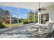 Bright, screened lanai with water views and beautiful landscaping at 3390 Yonge Ave # 41, Sarasota, FL 34235