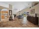 Open-concept living area with tile flooring, leading to the kitchen and outdoor living space at 3390 Yonge Ave # 41, Sarasota, FL 34235
