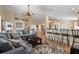 Spacious living area with ceiling fan, neutral walls, and a comfortable gray sofa over a contemporary rug at 3390 Yonge Ave # 41, Sarasota, FL 34235