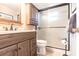Well-maintained bathroom with a walk-in shower, modern vanity, and convenient storage at 3620 Ironwood Cir # 606, Bradenton, FL 34209