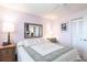 Comfortable bedroom features a ceiling fan, large window, and comfortable queen-sized bed at 3620 Ironwood Cir # 606, Bradenton, FL 34209