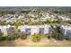 Condo building with manicured lawns and trees behind the building at 3620 Ironwood Cir # 606, Bradenton, FL 34209