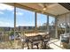 Relaxing lanai with a ceiling fan, tile floor, and panoramic views of the pond and city at 3620 Ironwood Cir # 606, Bradenton, FL 34209