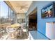Enclosed lanai with seating area, ceiling fan, and beautiful views at 3620 Ironwood Cir # 606, Bradenton, FL 34209
