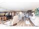 Bright living room with a large mirror, comfortable seating, and views of the golf course at 3620 Ironwood Cir # 606, Bradenton, FL 34209