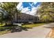 View of the condos from the street showing the sidewalk and covered parking at 3620 Ironwood Cir # 606, Bradenton, FL 34209