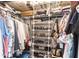 Organized walk-in closet with ample shelving, rods, and storage solutions for clothing and accessories at 3620 Ironwood Cir # 606, Bradenton, FL 34209