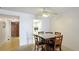 Dining room featuring a square table and a view into the entry and kitchen at 3763 Lake Bayshore Dr # 310, Bradenton, FL 34205
