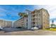 The exterior of a residential building includes multiple balconies and private parking at 3763 Lake Bayshore Dr # 310, Bradenton, FL 34205