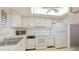 A well-lit kitchen is equipped with white appliances and ample cabinet space at 3763 Lake Bayshore Dr # 310, Bradenton, FL 34205