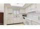 Bright kitchen featuring white appliances and plenty of counter space at 3763 Lake Bayshore Dr # 310, Bradenton, FL 34205