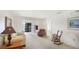 Spacious open-concept living area showing the light-filled room with sliding glass doors and rocking chair at 3763 Lake Bayshore Dr # 310, Bradenton, FL 34205
