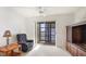 Living room featuring a comfortable recliner, entertainment center and a sliding glass door to a balcony at 3763 Lake Bayshore Dr # 310, Bradenton, FL 34205