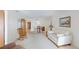Open-concept living area featuring neutral carpet and a view of the dining room and kitchen at 3763 Lake Bayshore Dr # 310, Bradenton, FL 34205