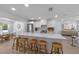 Bright kitchen with island seating, stainless appliances, and modern cabinetry at 414 79Th St, Holmes Beach, FL 34217