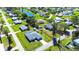 Aerial view of a nice home in a green neighborhood near a tranquil pond at 4404 5Th W Ave, Palmetto, FL 34221