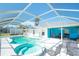 Stunning pool area complete with jacuzzi and adjacent outdoor dining at 4404 5Th W Ave, Palmetto, FL 34221