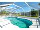 Inviting screened pool with clear blue water and plenty of lounging space at 4404 5Th W Ave, Palmetto, FL 34221