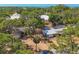 Scenic aerial view of a home with mature trees and landscaping, offering a private and serene setting at 448 58Th St, Sarasota, FL 34243