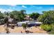 Aerial view of a single-story home with a well-maintained yard and mature trees at 448 58Th St, Sarasota, FL 34243