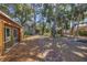 Spacious backyard featuring mature trees and meticulous landscaping at 448 58Th St, Sarasota, FL 34243