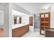 Bathroom featuring double sinks, a barn door, and a sleek stone shower at 448 58Th St, Sarasota, FL 34243