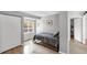 This cozy bedroom features a light hardwood floor, window, closet, and minimalist decor at 448 58Th St, Sarasota, FL 34243